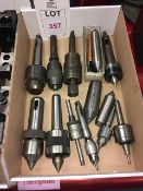 Nine assorted taper and straight shank drill chucks, revolving centres, and three dead centres, in