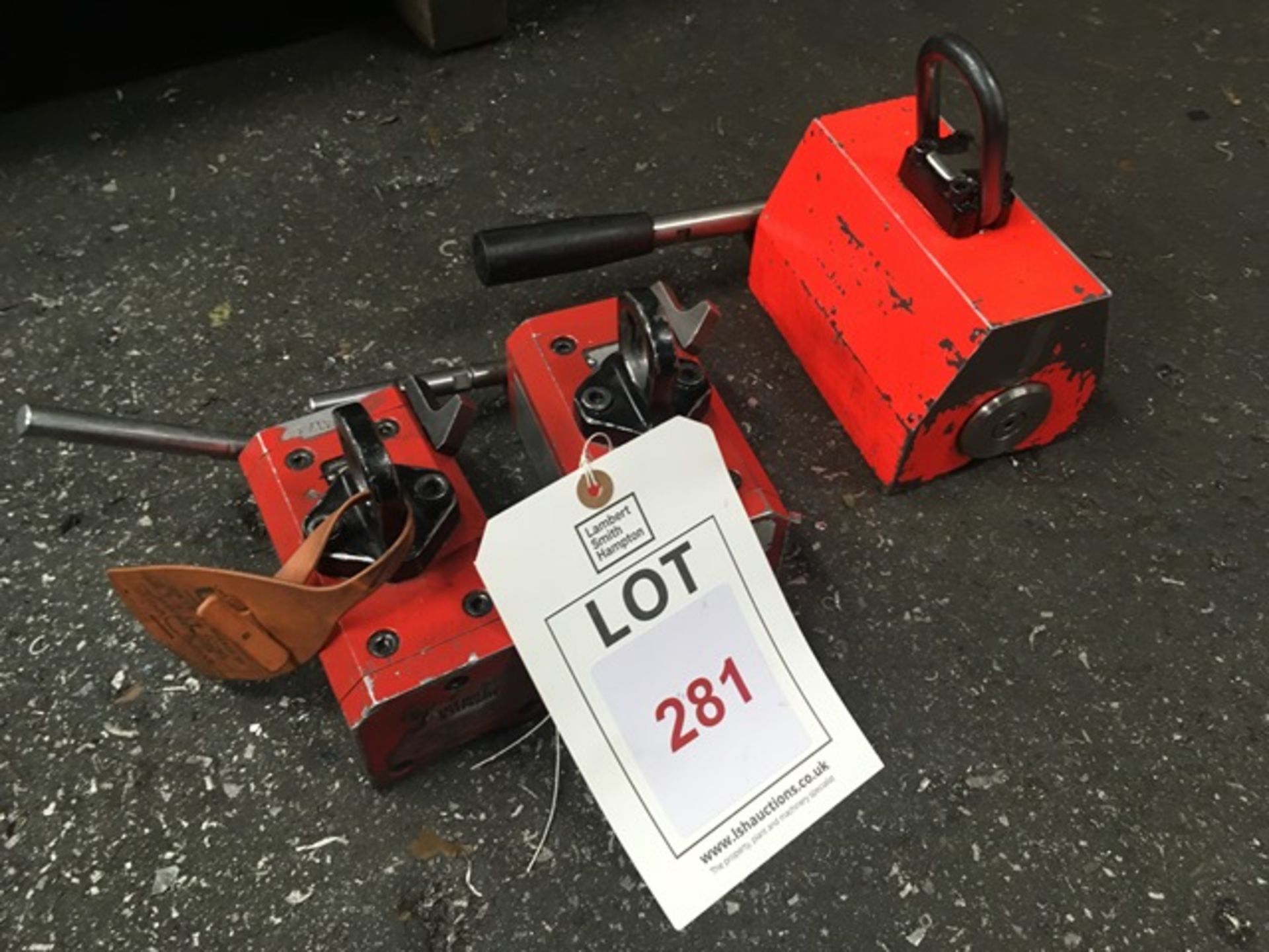 Three assorted magnetic plate lifters, two Ultralift LM0125, and one other unbadged. Thorough..