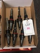 Sixteen BT40 taper shank tool holders, fitted tooling, in two boxes