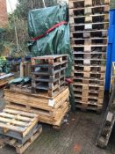 Quantity of timber pallet sides and chipboard base panels in three stacks