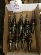 Nineteen BT40 taper shank tool holders, fitted tooling, in three boxes