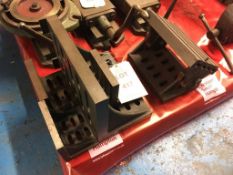 Four assorted cast iron slotted angle plates and an adjustable tilt t slot bed