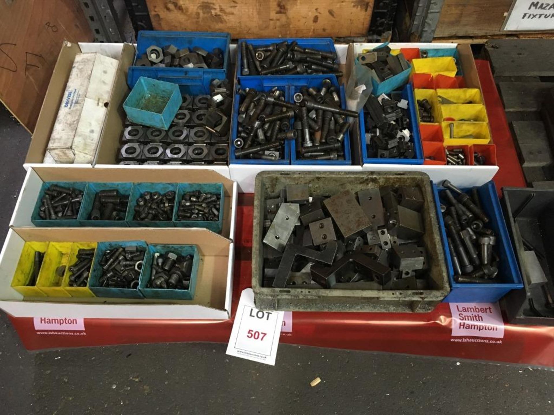 Assorted clamps, bolts, etc., as lotted, one pallet