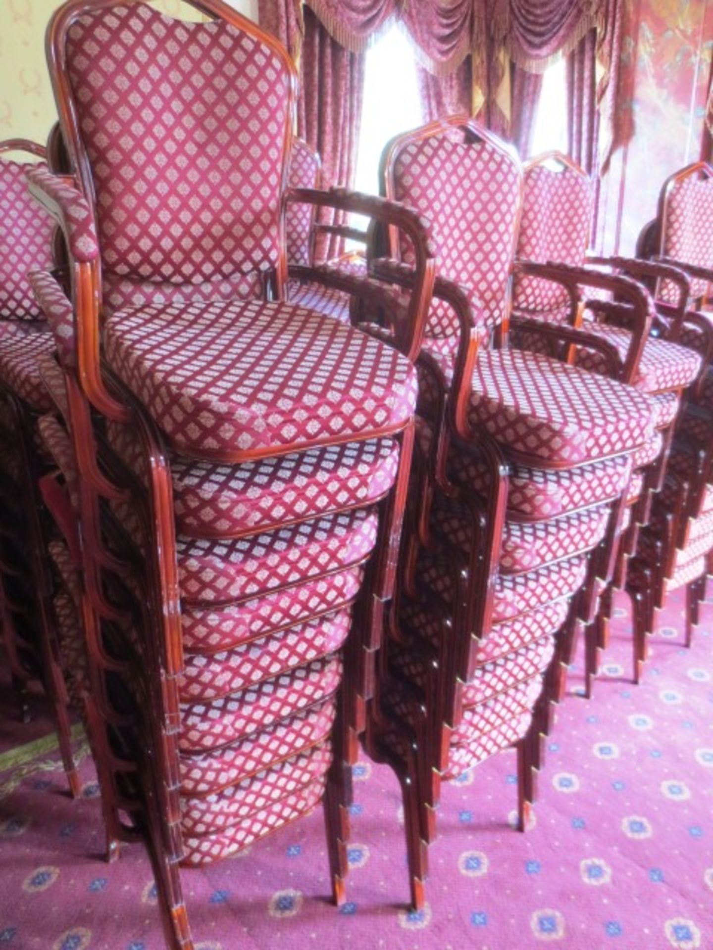 Twenty steel framed, red cloth upholstered, stackable chairs (Please note: image for illustrative - Image 2 of 2