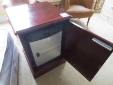Dark-wood single door cabinet with fitted Electrolux fridge