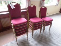 Twelve steel-framed red cloth upholstered stackable chairs