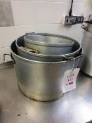 Three assorted stainless steel pots, ranging from 380mm to 500mm dia