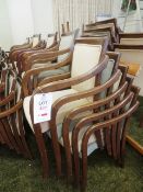 Approximately 35 timber-framed green cloth upholstered stacking chairs