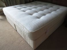 Two cream cloth upholstered single divan style beds and king size mattress