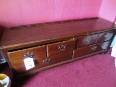 Dark-wood six drawer dresser unit, approx. 2m in length and two matching bedside units