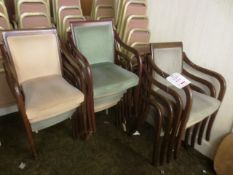 Fifteen timber-framed green cloth upholstered stacking chairs