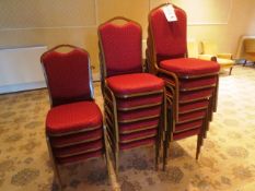 Seventeen steel-framed red cloth upholstered stackable chairs