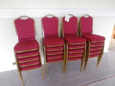 Twenty steel-framed red cloth upholstered stackable chairs