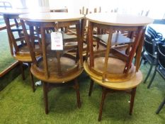 Twelve dark-wood effect circular tables