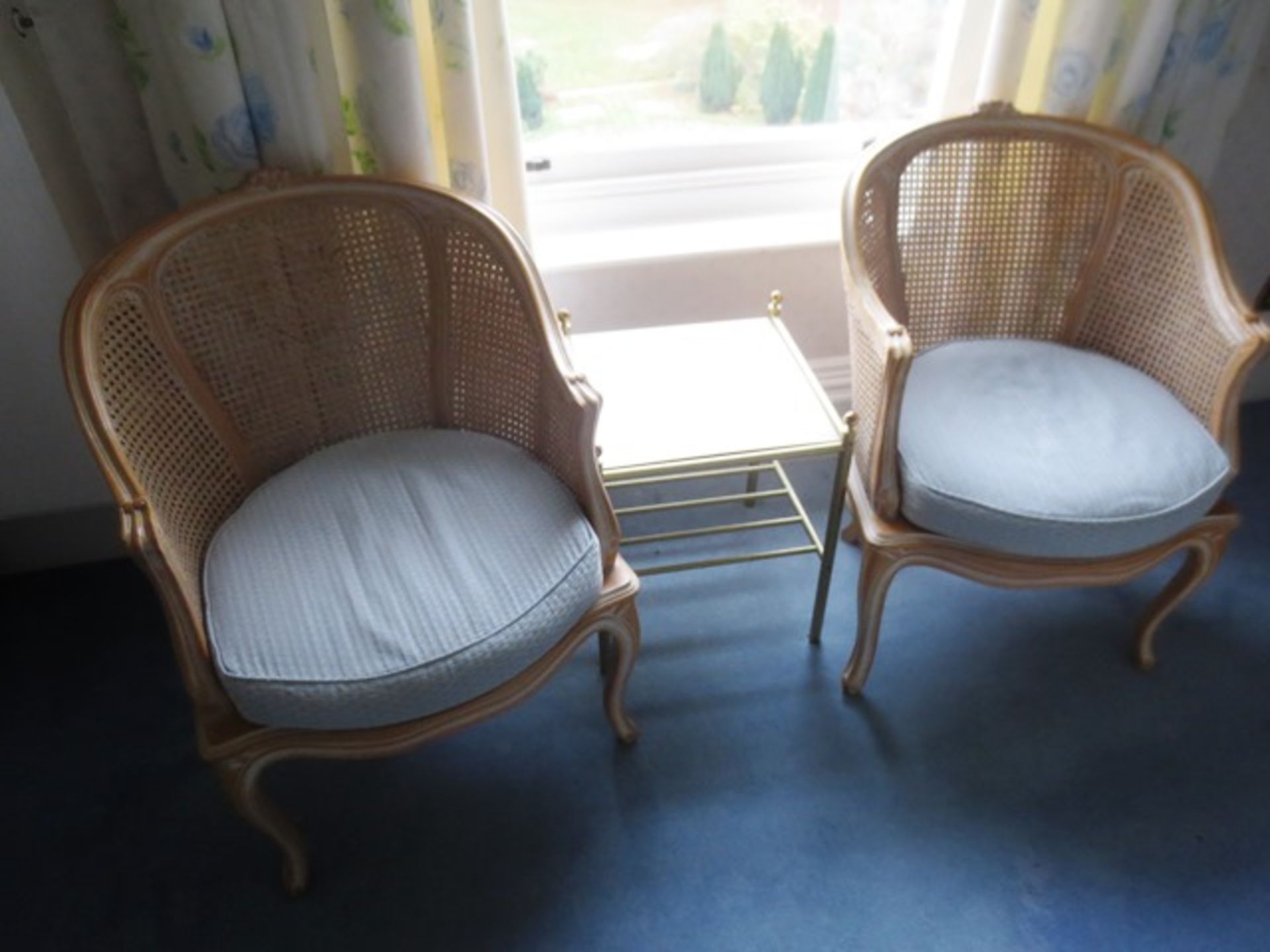 Two wicker-effect chairs and coffee table