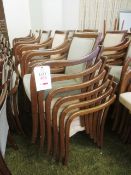 Approximately 30 timber-framed green cloth upholstered stacking chairs