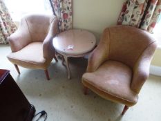 Two cloth upholstered arm chairs and circular table