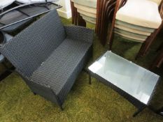 Black, wicker-effect two seater chair and matching glass topped coffee table