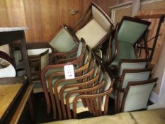 Seventeen timber-framed green cloth upholstered stacking chairs