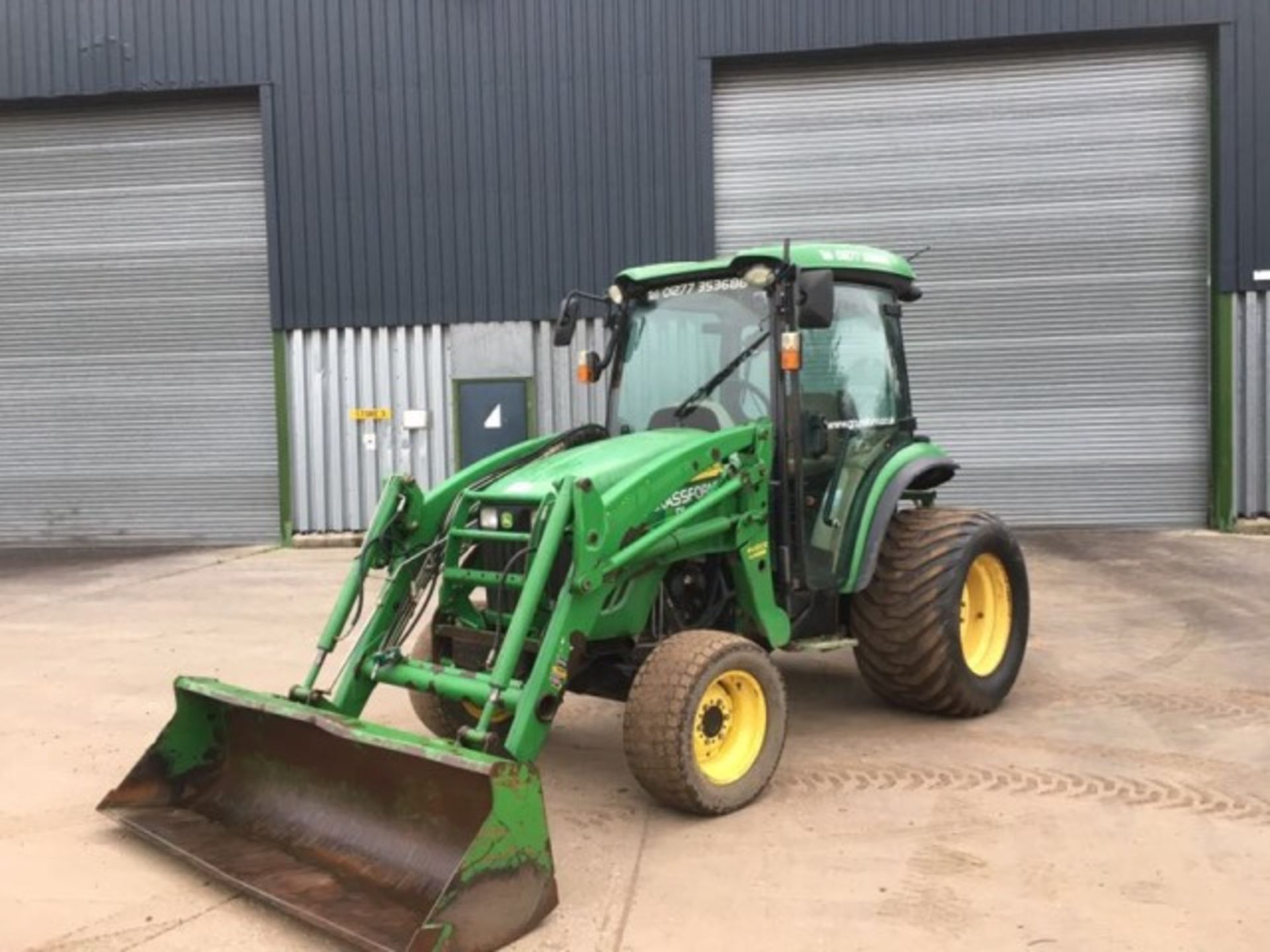 John Deere 4720 compact tractor fitted with grassland tyres, 66 HP, with 400CX front loader,