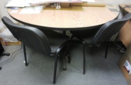Light wood semi circular table and two black cloth upholstered static chairs