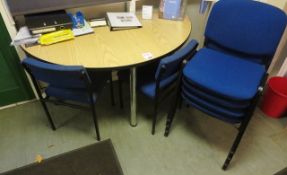 Light wood semi circular table and six assorted blue cloth upholstered static meeting room chairs