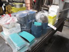 Quantity of assorted grade sanding pads, linisher belt, etc.