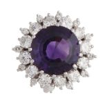 A magnificent amethyst and diamond cluster dress ring in white gold or platinum, the large,