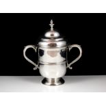 An antique Queen Anne Britannia Silver cup and cover by Edmund Pearce, London 1710. The tapering