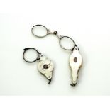 A pair of antique 19th Century lorgnettes / opera glasses in mother of pearl and silver, together