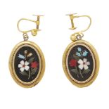 A pair of pietra dura screw back earrings set in yellow gold, the oval black panels inset with