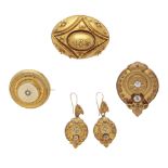 An antique yellow metal brooch set with white paste stones, together with a similar pair of