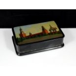 A Soviet Russian lacquer cigarette box circa 1957. Of rounded rectangular form raised on four bun