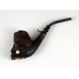 A novelty antique meerschaum smoking pipe carved to depict the head of an elderly gentleman, with