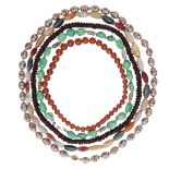A selection of various hardstone bead necklaces including two garnet necklaces, a set of amber