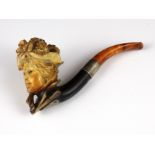 An antique silver meerschaum smoking pipe finely carved to depict the bust of a lady wearing a