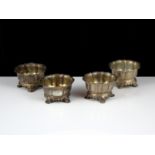 A set of four regimental antique Victorian Sterling Silver salt cellars by Benjamin Smith, London