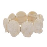 An antique 19th century carved ivory cameo bracelet, comprising eight oval panels each with a carved