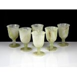 A set of six green hardstone goblets, probably in alabaster or onyx / agate, carved in typical