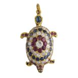 A novelty jewelled turtle pendant in yellow metal, set with diamonds, rubies and sapphires, the