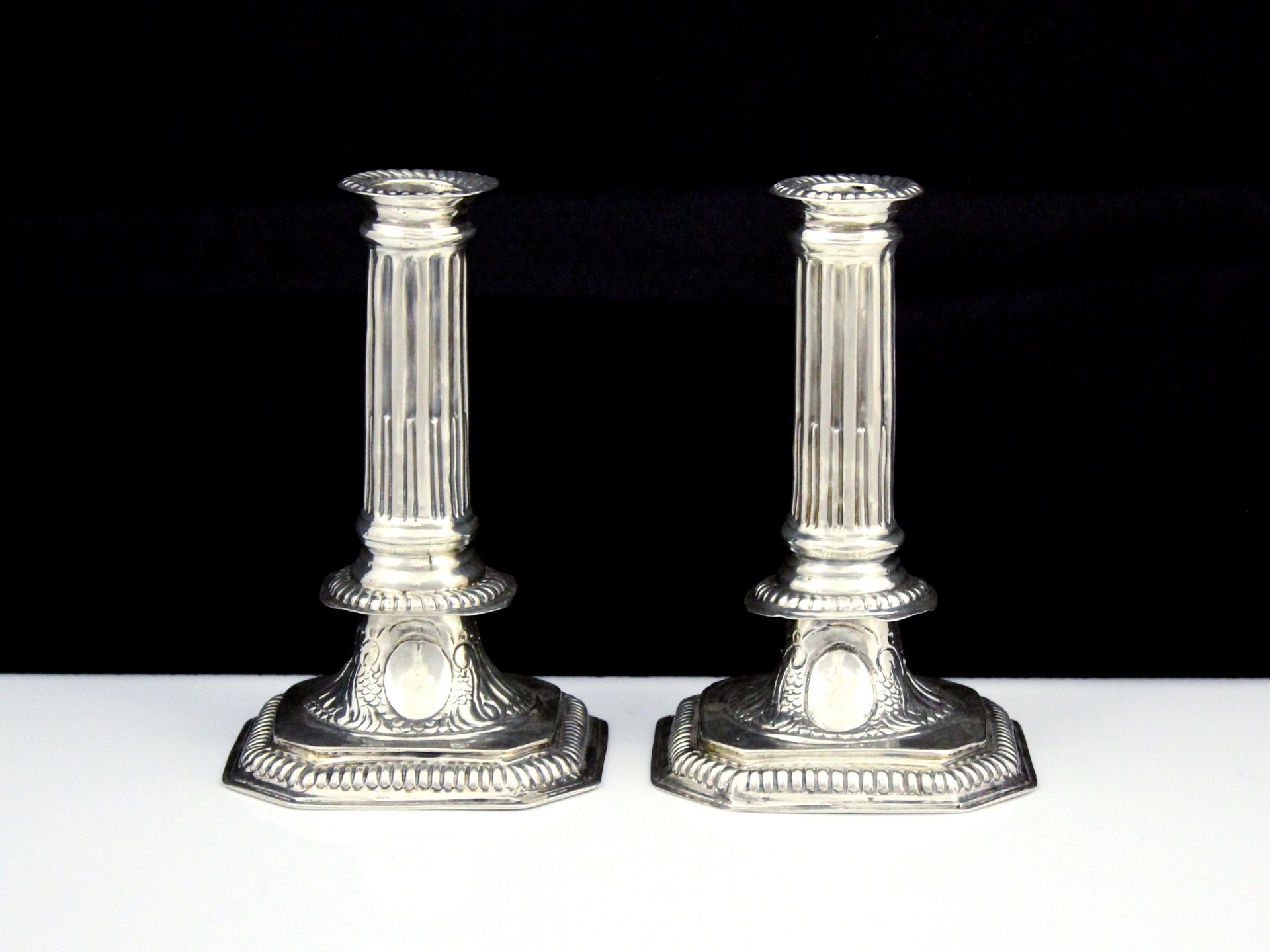 A pair of antique William III Britannia Silver candlesticks by Charles Overing, London 1697. The