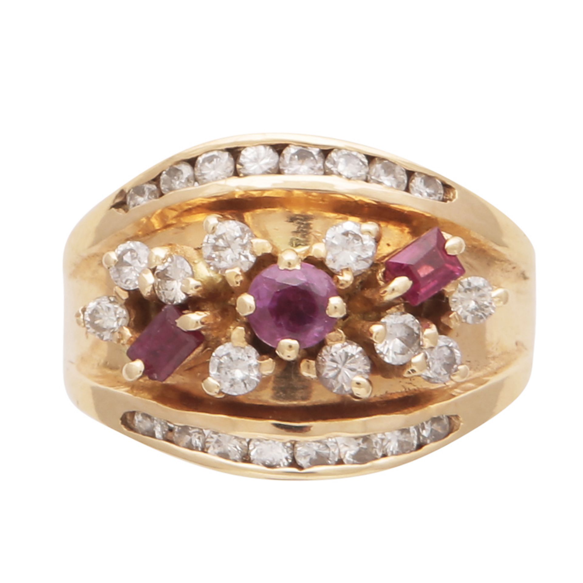 An antique ruby and diamond dress ring in 18ct yellow gold set with a one round and two