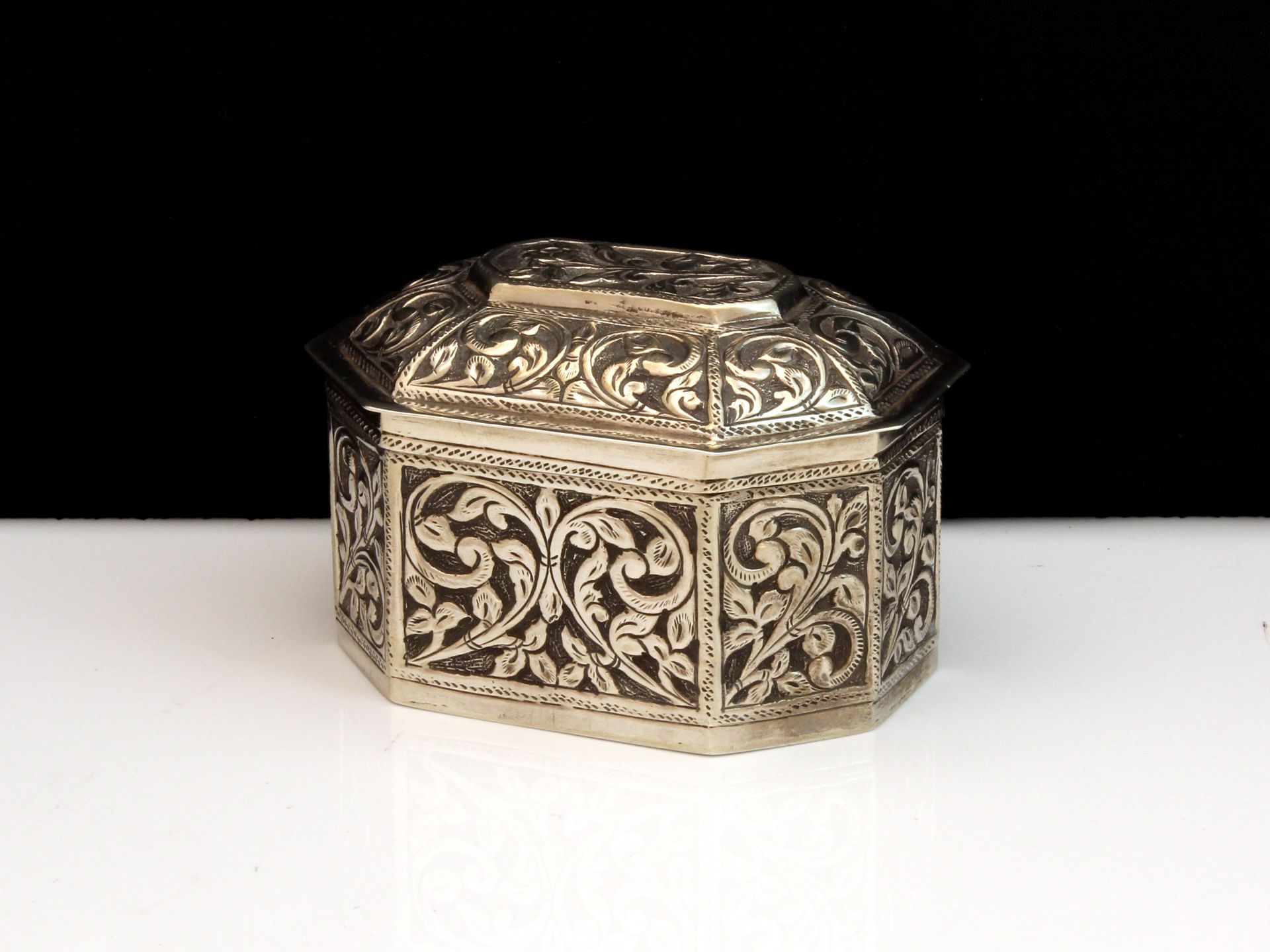 An antique German Silver ring / trinket box stamped 800 of cut cornered rectangular form with a