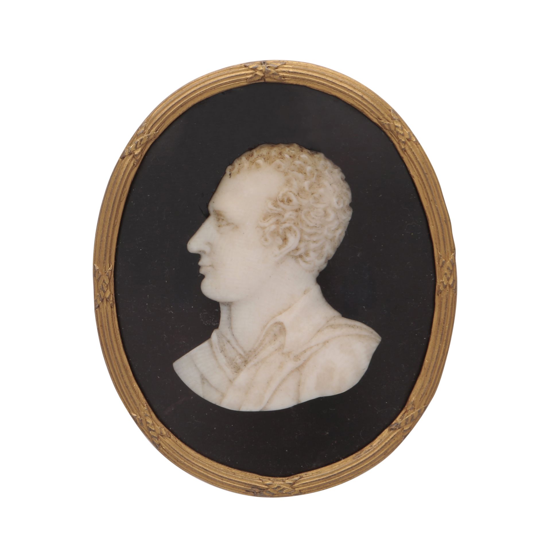 A Regency carved ivory cameo / miniature possibly French carved in detail to depict the bust of a