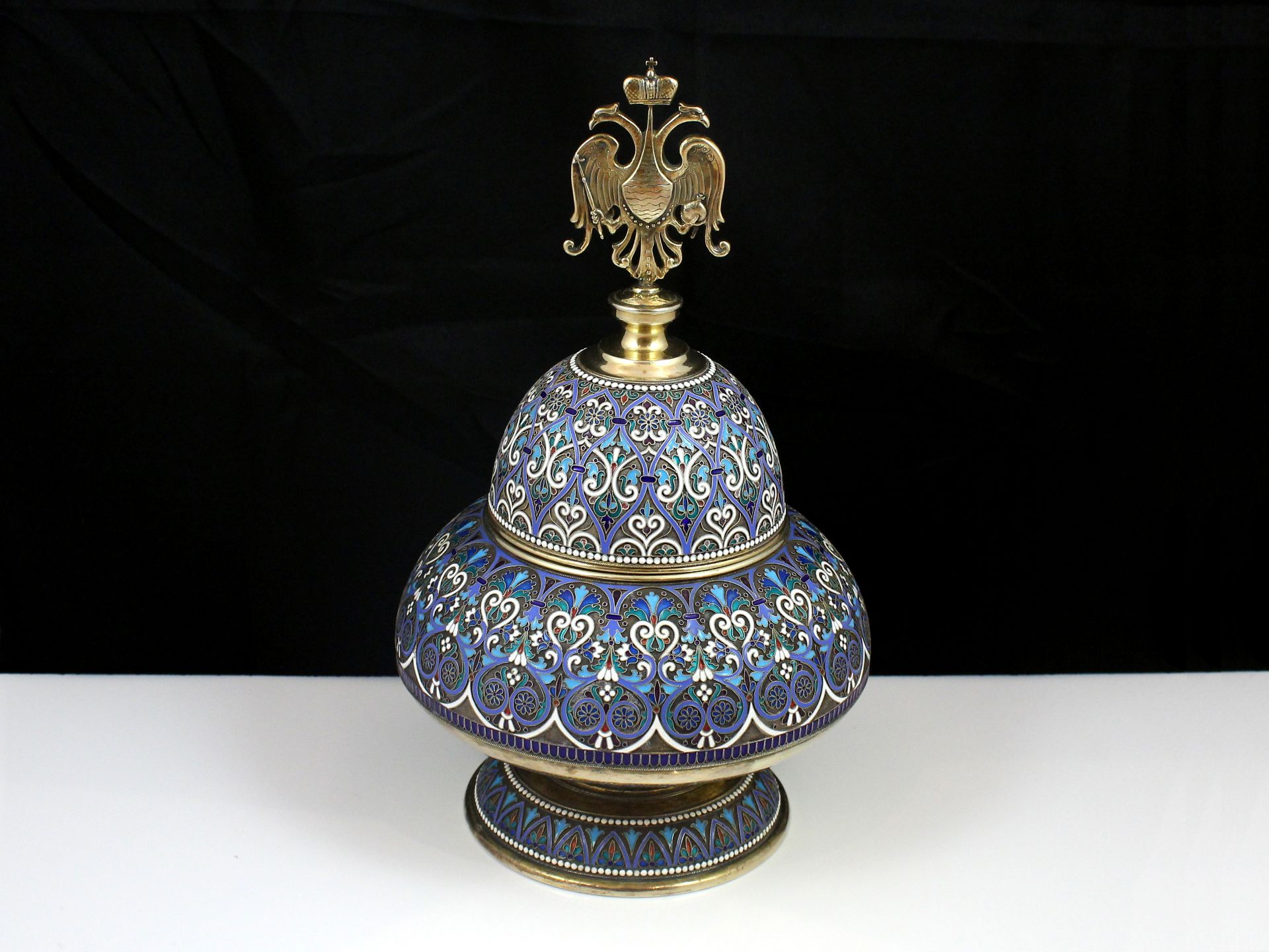 A spectacular Russian 84 Zolotnik Silver bowl and cover marked A Kuzmichev in Cyrillic, and