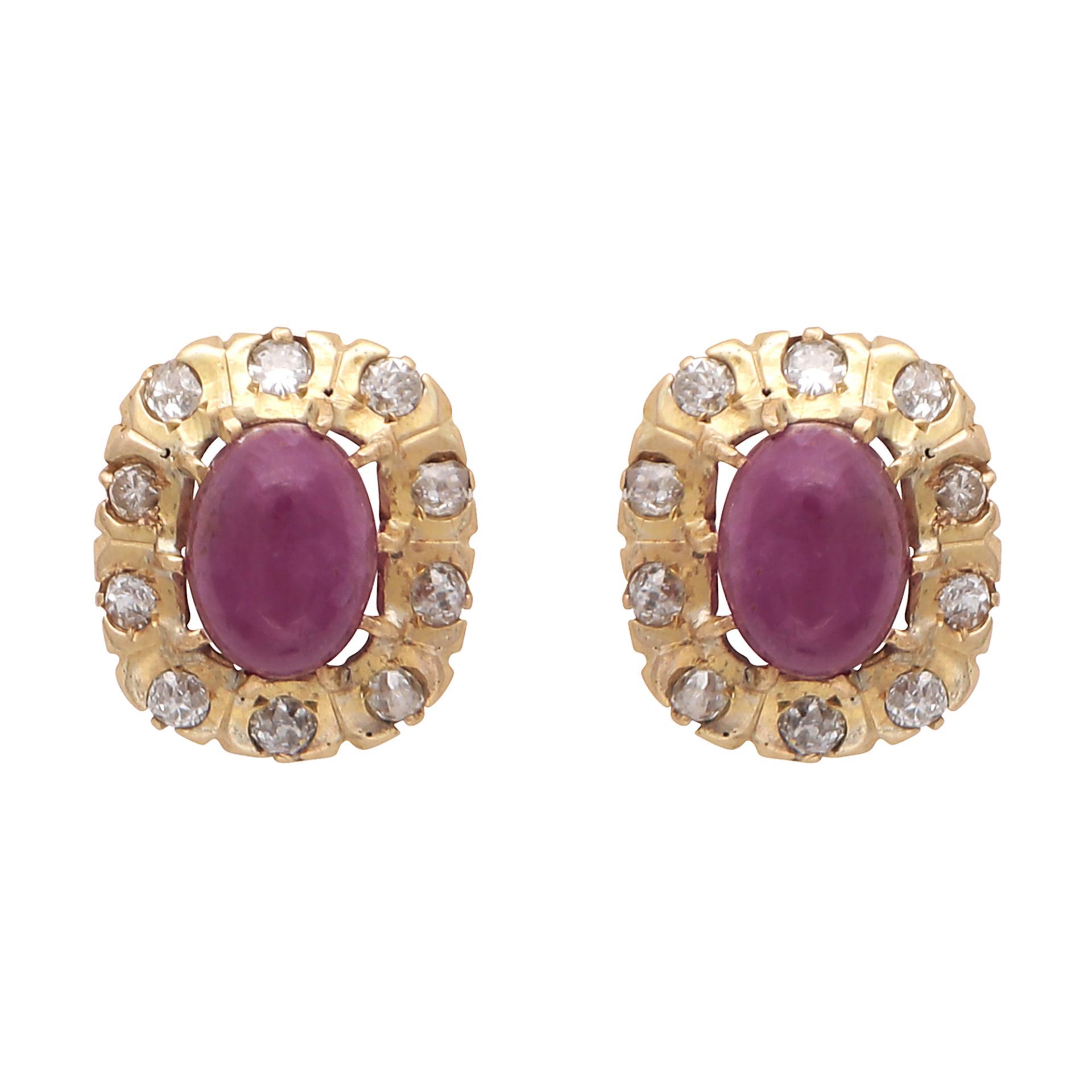 A pair of ruby and diamond cluster earrings in yellow gold each set with an oval cabochon ruby