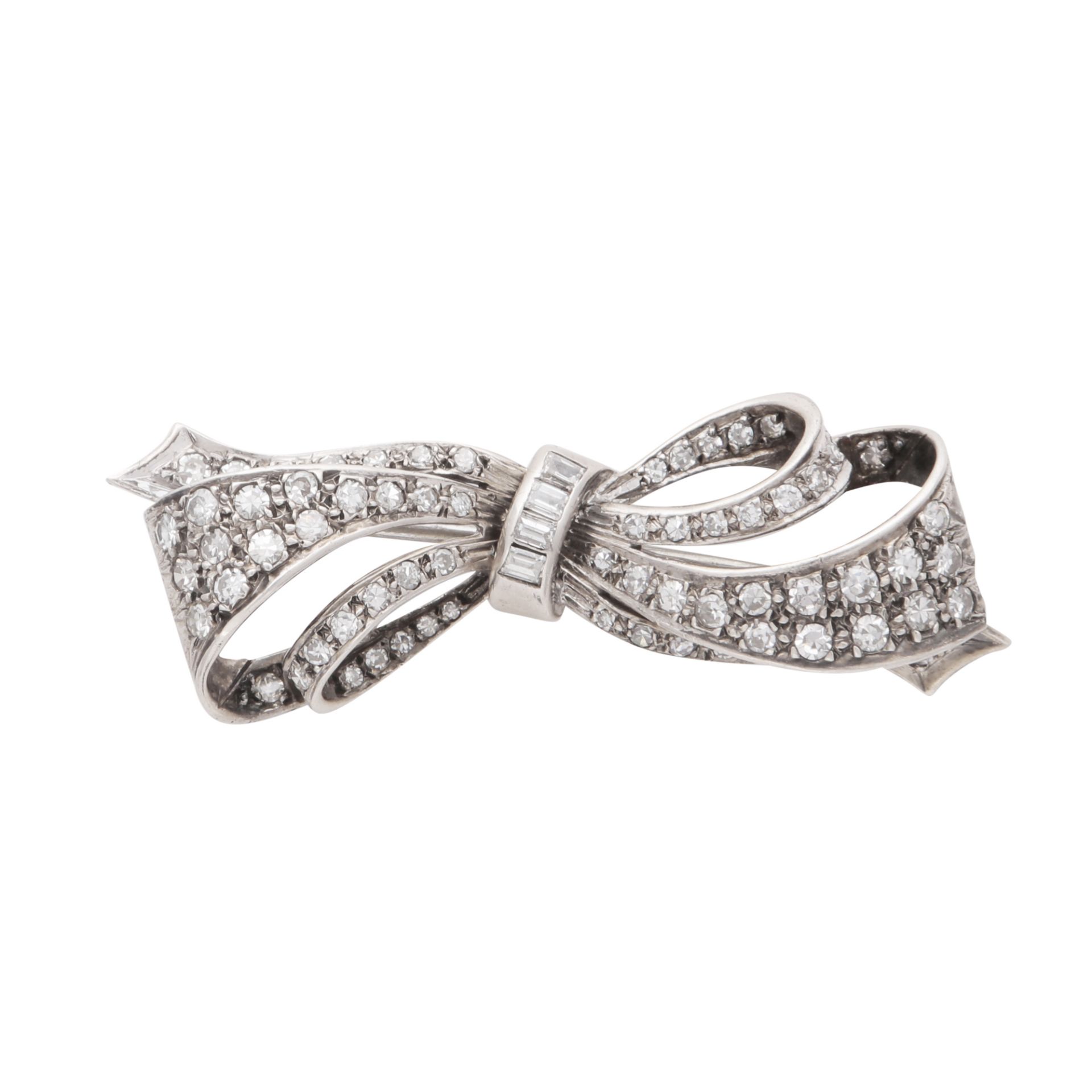 An antique late Victorian diamond bow brooch in platinum, designed as a double tied bow, jewelled
