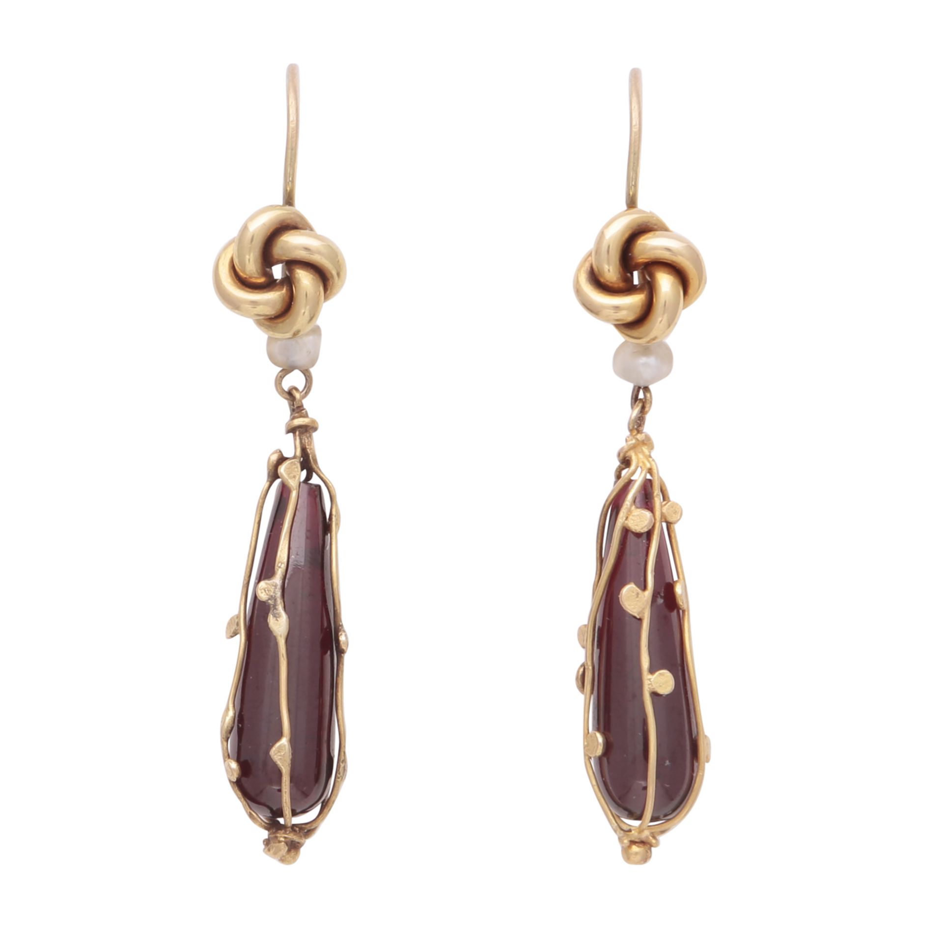 A pair of antique garnet and pearl drop earrings in yellow gold each designed as a cabochon drop
