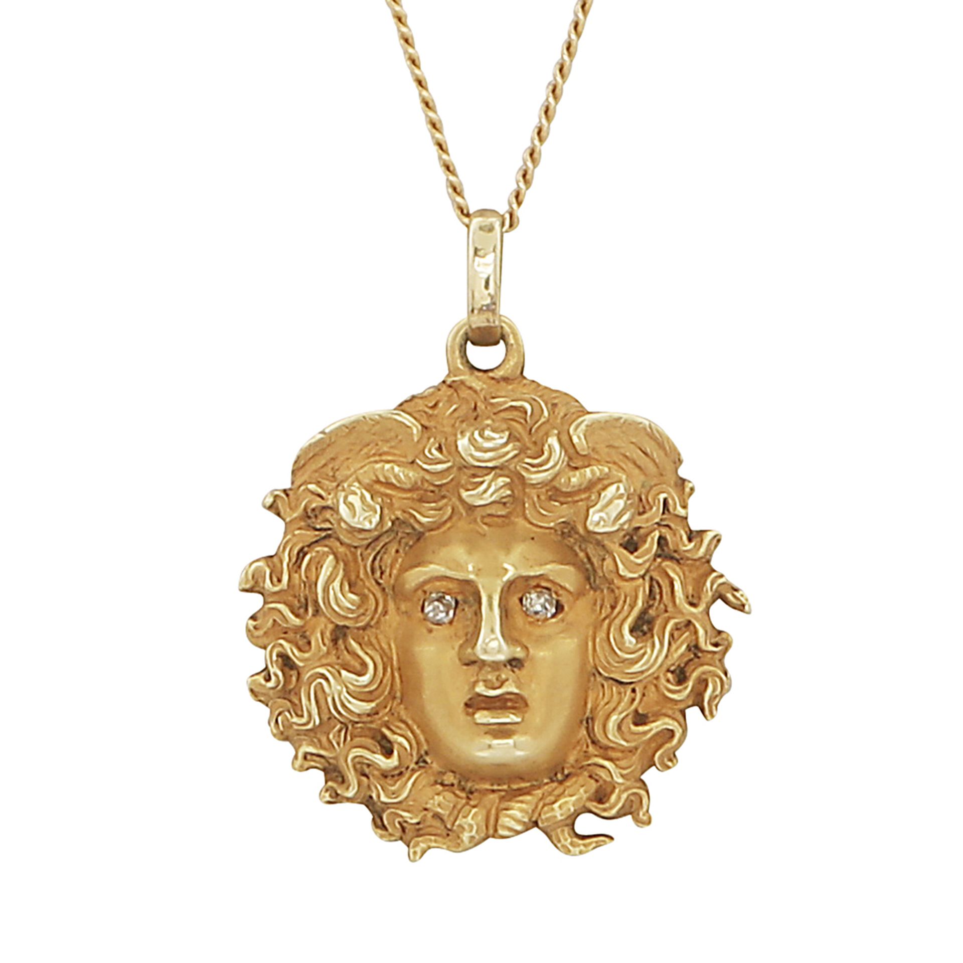 GREEK MYTHOLOGY - An antique jewelled pendant and chain in high carat yellow gold, modeled as the