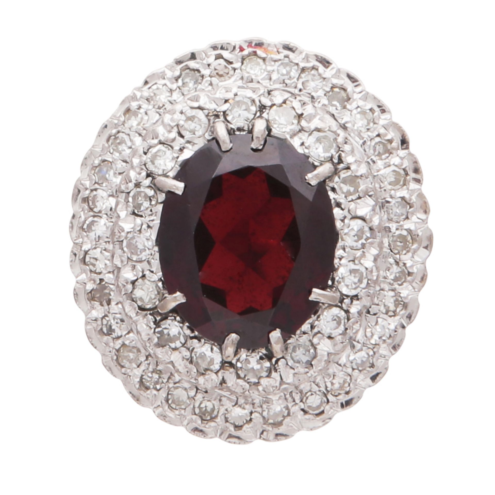 A garnet and diamond cluster ring in 18ct yellow gold, the large oval cut garnet weighing